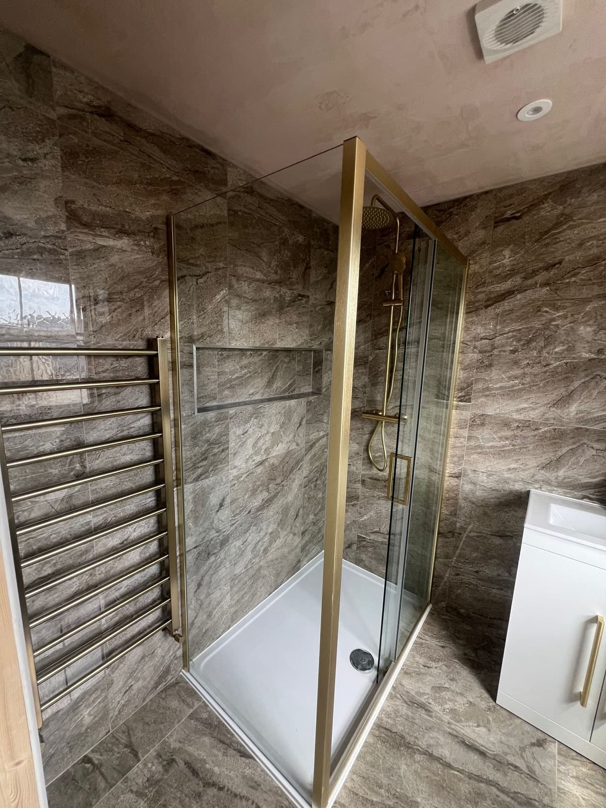 Walk-in shower, brushed gold fittings