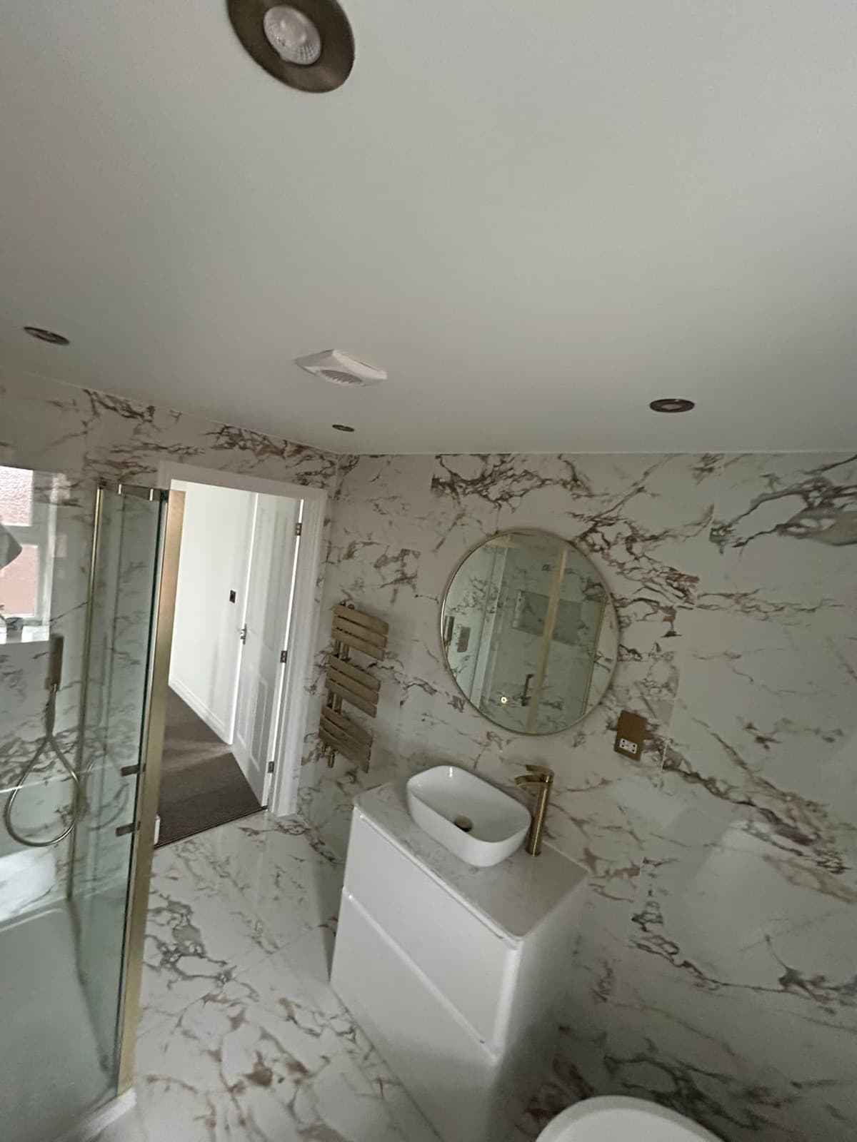Vanity, mirror and heated towel rail